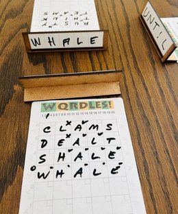 WQRDLES: A Tactile Wordle-Like Multi-Player Word Deduction Game
